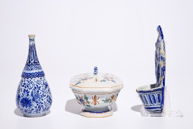 A Dutch Delft blue and white holy water font and a vase, with a polychrome covered spice box, 18th C.