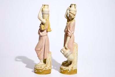 A pair of large Royal Dux Greek style figures carrying jugs, Bohemia, early 20th C.