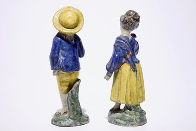 A pair of polychrome French faience figures of a young couple, North of France, late 18th C.