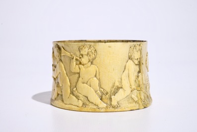 A finely carved ivory box with boys playing music, probably French, 18/19th C.