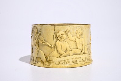 A finely carved ivory box with boys playing music, probably French, 18/19th C.