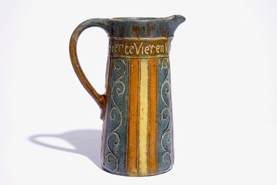 A Flemish pottery jug with proverbial inscription, signed LMV, Torhout, ca. 1900