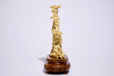 A Chinese carved ivory group of Lan Cai He with a servant, early 20th C.