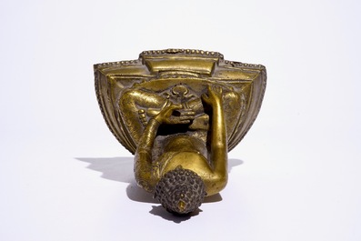 A gilt bronze model of Buddha seated on a throne, Nepal or Tibet, 19/20th C.