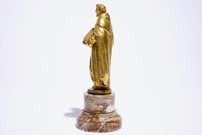 A gilt bronze model of a saint on a later marble base, 17th C.