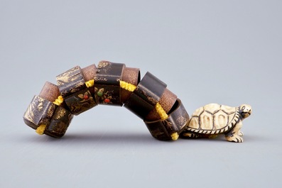 A Japanese four-case lacquer inro with ivory turtle netsuke, Meiji, 19th C.