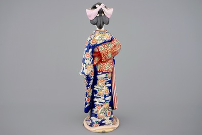 A large Japanese Kutani figure of a bijin, Meiji, 19th C.