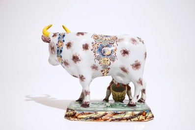 A polychrome Dutch Delft cow milking group, 18th C.