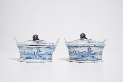 A pair of Dutch Delft blue and white butter tubs with blackberry finials, 18th C.