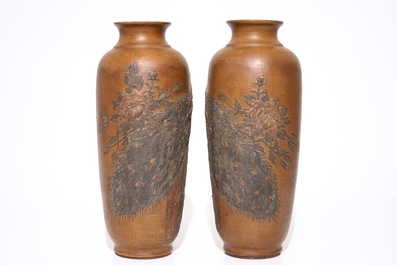 A pair of Chinese Yixing stoneware vases with applied peacock design, 20th C.