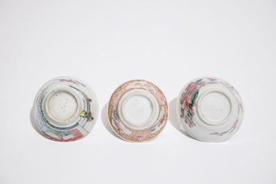 Three Chinese famille rose cups and two saucers, Yongzheng/Qianlong