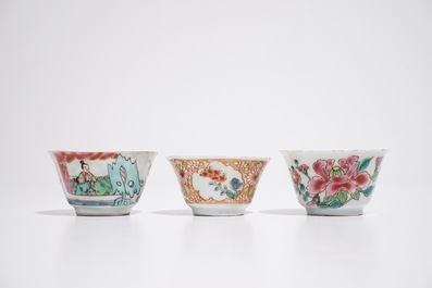 Three Chinese famille rose cups and two saucers, Yongzheng/Qianlong