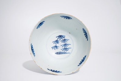 A Dutch Delft blue and white chinoiserie bowl with dragons, late 17th C.