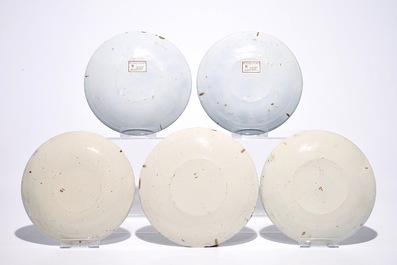 A pair and a set of three Dutch Delft polychrome plates, 18th C.