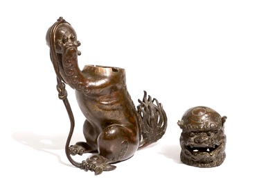 A Chinese lacquered bronze censer modelled as a buddhist lion with a brocade ball, Ming