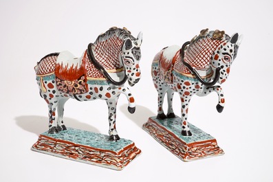 A pair of Dutch Delft polychrome petit feu models of horses, 18th C.