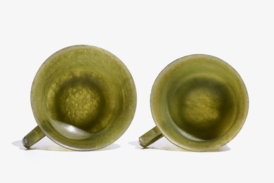 A pair of Chinese green jade cups and saucers, 19th C.