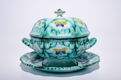 A Brussels faience tureen and cover on stand with butterflies and caterpillars, 18th C.