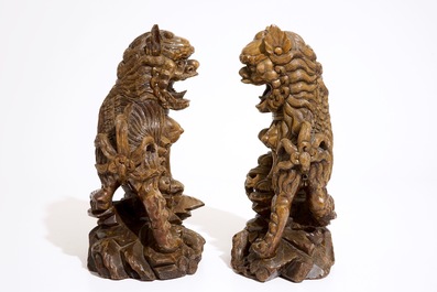 A pair of Chinese carved wood figures of temple lions, 19/20th C.