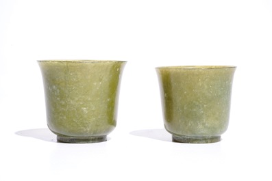 A pair of Chinese green jade cups and saucers, 19th C.