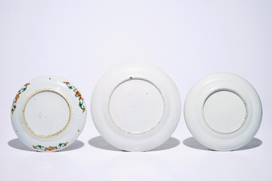 Three Chinese famille rose and verte on yellow ground plates, 19th C.