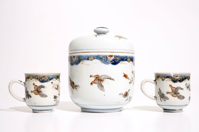A pair of Chinese grisaille, gilt and iron red cups and saucers and a covered bowl, Qianlong