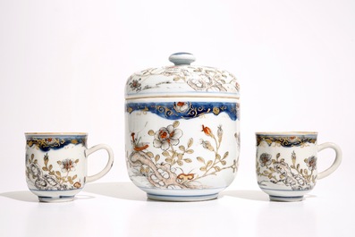 A pair of Chinese grisaille, gilt and iron red cups and saucers and a covered bowl, Qianlong