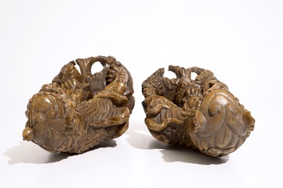 A pair of Chinese carved wood figures of temple lions, 19/20th C.