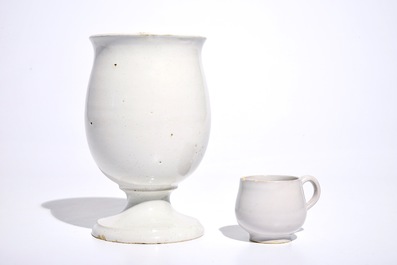 A white Dutch Delft drug jar on foot and a cup with ear, 18th C.