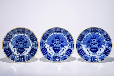 Four Dutch Delft blue and white chargers and two plates with &quot;Peacock's tail&quot; pattern, 18th C.