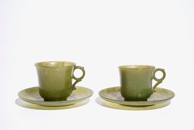 A pair of Chinese green jade cups and saucers, 19th C.