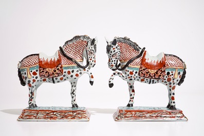 A pair of Dutch Delft polychrome petit feu models of horses, 18th C.