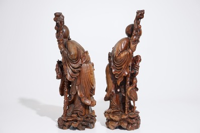 A pair of tall Chinese carved wood figures of immortals, 19/20th C.