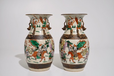 A pair of Chinese famille rose Nanking crackle glaze warrior vases, 19th C.