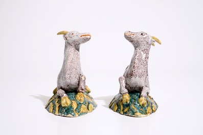 A pair of large Dutch Delft polychrome models of goats on a ground, 18th C.