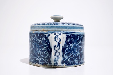A Dutch Delft blue and white butter tub and cover and a small fluted plate, 18th C.