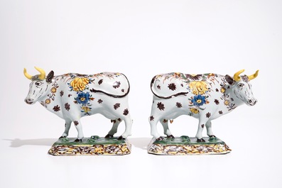 A pair of large polychrome Dutch Delft models of cows, 18th C.