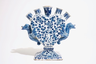 A Dutch Delft blue and white heart-shaped tulip vase with cupids, ca. 1700