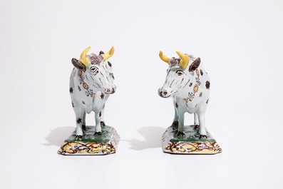 A pair of large polychrome Dutch Delft models of cows, 18th C.