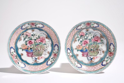 A pair of Chinese famille rose cups and saucers with a cat near a flower basket, Yongzheng