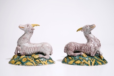 A pair of large Dutch Delft polychrome models of goats on a ground, 18th C.