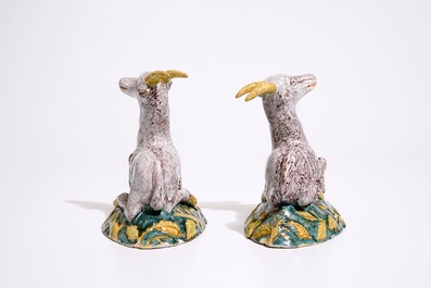 A pair of large Dutch Delft polychrome models of goats on a ground, 18th C.