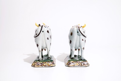 A pair of large polychrome Dutch Delft models of cows, 18th C.