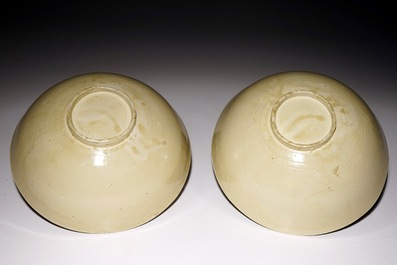A pair of Chinese monochrome cream-glazed bowls, Northern Song or Jin