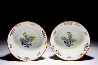 A pair of rare polychrome Dutch Delft bowls and covers, early 18th C.