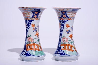 A pair of Dutch Delft polychrome petit feu Kakiemon-style vases, 18th C.