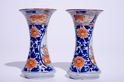 A pair of Dutch Delft polychrome petit feu Kakiemon-style vases, 18th C.