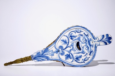 A blue and white French faience bellows with grotesques, signed for Laugier-Olerys, Moustiers, 18th C.