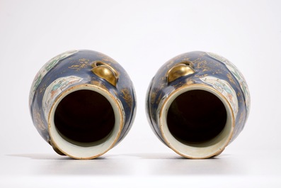 A pair of Chinese famille verte on powder blue and gilt ground vases, 19th C.