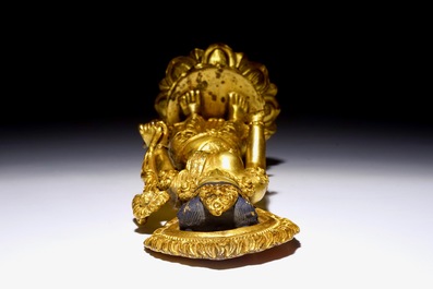 A Chinese gilt bronze figure of Tara standing on a lotus base, 19th C.
